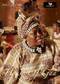 a woman in traditional clothing in front of a group of people