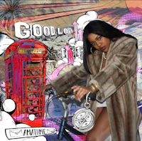 a woman in a fur coat on a bicycle next to a telephone booth